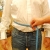 To measure midsection circumference, position tape at fullest part of waist  