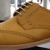 Light brown leather wingtips with wood soles